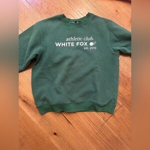 A cozy crewneck with matching bottoms it’s green